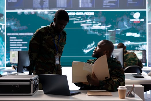 Military experts in an operations center handle satellite data details, overseeing live surveillance for reconnaissance activity. Intelligence operations to support strategic military missions. photo