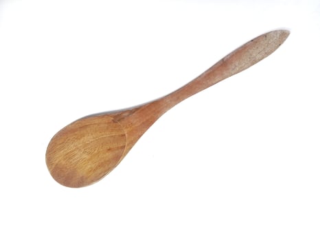 One empty brown wooden spoon isolated on white background with copy space area photo