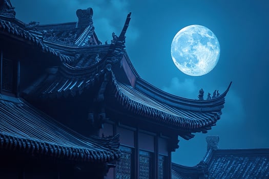 Roof of a traditional oriental building in the moonlight. Roof of a building in Korea, China or Japan. photo