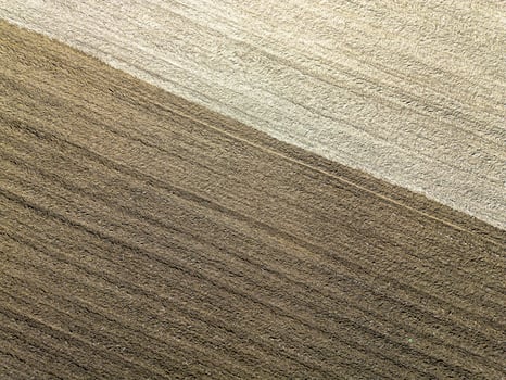 Plowed agricultural field, view from above, background. photo