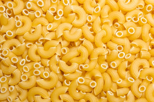 Uncooked Chifferi Rigati Pasta. A Culinary Canvas of Chifferi Rigati, Creating a Lively and Textured Background for Gourmet Cooking. Dry Pasta. Raw Macaroni - Top View, Flat Lay photo