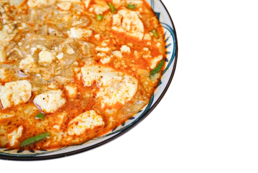Spicy Kway Teow Soup with Tofu isolated on white background photo