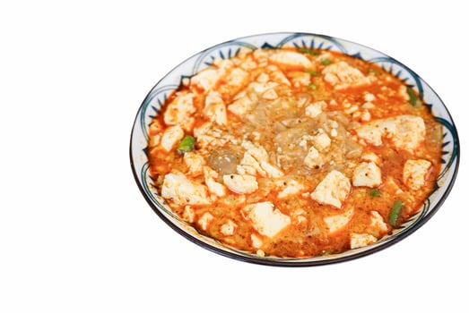 Spicy Kway Teow Soup with Tofu isolated on white background photo