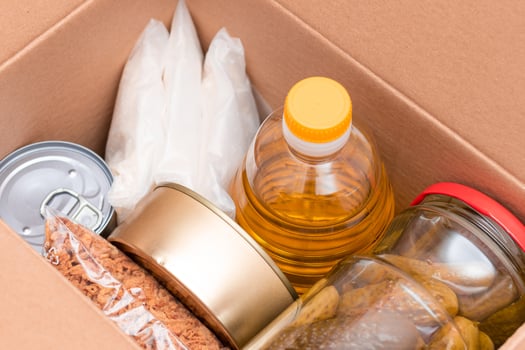 Food Reserves or Donation Box. Carton Box with Canned Food, Cereals and Grocery. Emergency Food Storage in Case of Crisis. Free Social Help, Blessings and Care. Strategic Food Supplies photo