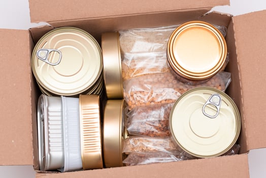Food Reserves or Donation Box. Carton Box with Canned Food, Cereals and Grocery. Emergency Food Storage in Case of Crisis. Free Social Help, Blessings and Care. Strategic Food Supplies photo
