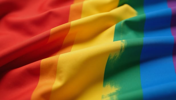 Closeup of a highresolution rainbow flag made from satin fabric with intricate folds and creases symbolizing LGBTQ pride and diversity photo