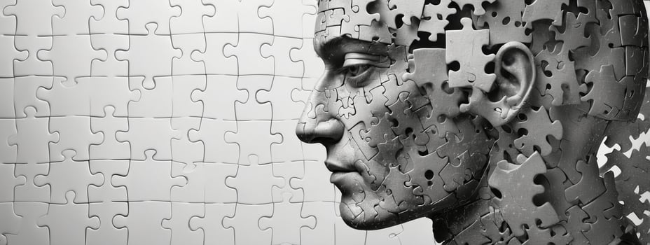 A man's head is made up of pieces of puzzle pieces photo