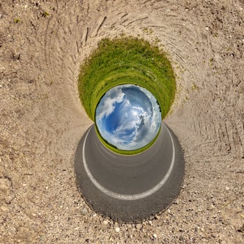 blue hole sphere or globe little planet inside green dry grass frame background photo