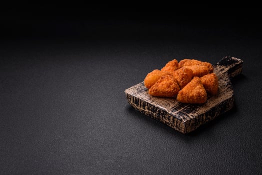 Brie cheese or camembert fries in breading, fast food, takeaway photo