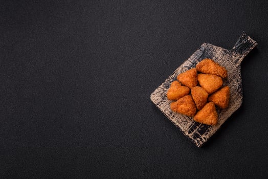 Brie cheese or camembert fries in breading, fast food, takeaway photo