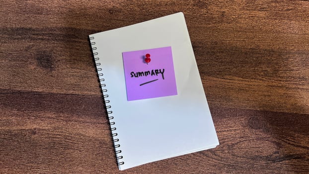 Concept of Summary write on sticky notes isolated on Wooden Table. photo