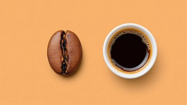 Coffee beans and cup on orange background photo