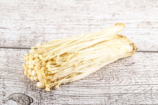 Tasty raw enoki mushroom heap photo