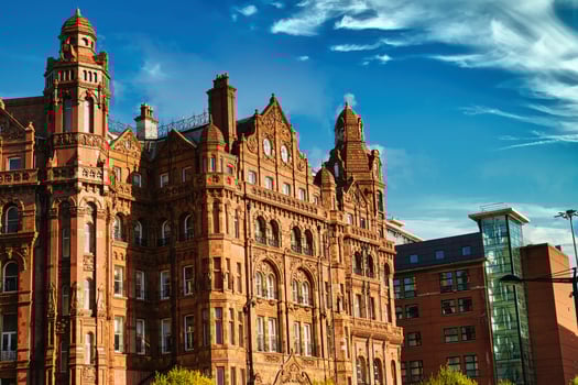 Ornate Brick Building with Towers and Turrets photo