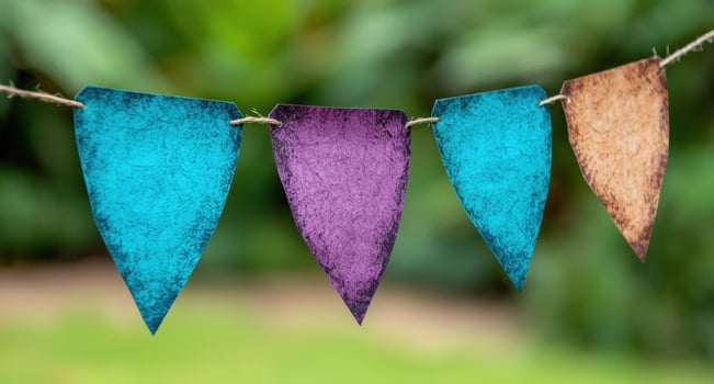 Colorful fabric banners hanging on a clothesline photo