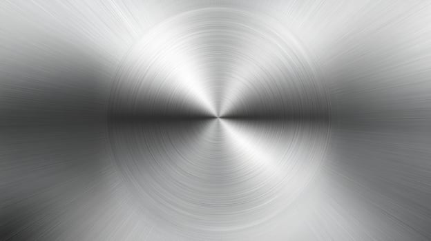 A polished metallic silver background with a brushed texture, ideal for industrial designs and presentations. Its reflective gray tones enhance visual appeal and add a modern touch photo