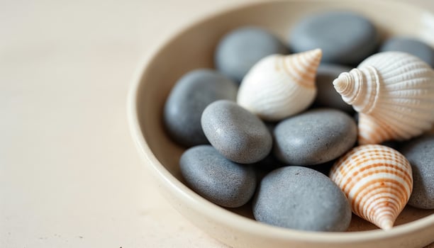 Stones and Shells on Beige Dish with Neutral Tones photo