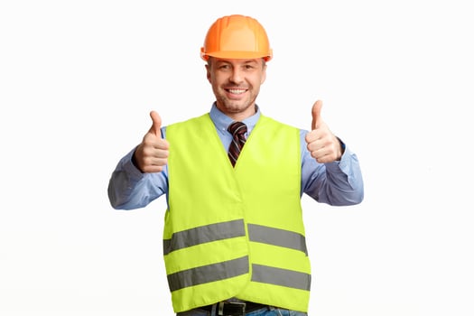 Happy Construction Worker Gesturing Thumbs Up Smiling To Camera Posing On White Background. Studio Shot photo