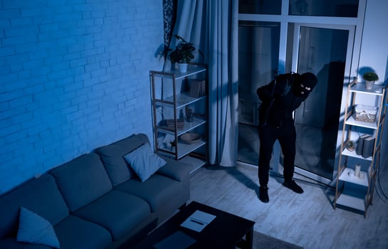 Housebreaking Concept. Intruder sneaking into house at night, holding crowbar, top view from above camera, high angle photo
