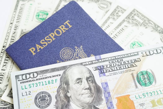 US passport issued to citizen and national of the United States of America to travel in most countries outside with USA flag and dollar money. photo