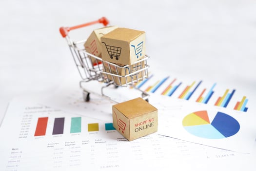 Online shopping, Shopping cart box on business graph, import export, finance commerce. photo