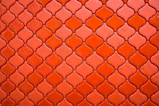 Orange tile background with a pattern of squares photo