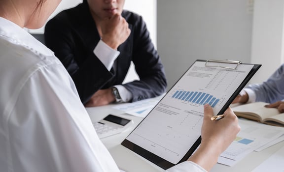 Team of Accountant Analyzing Financial Data and Discussing Calculation in a Modern Office Setting photo