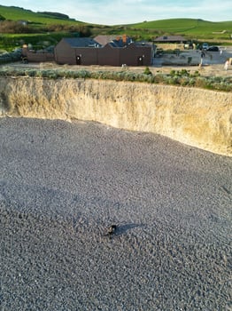 High Angle View of British Tourist Attraction of United Kingdom at Beachy Head headland Sea View and Ocean at Eastbourne, East Sussex, England. Drone's Camera Footage Was Captured on May 10th, 2024 photo