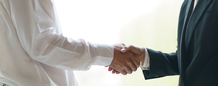 Businessman shaking hands successful making a deal. mans handshake. Business partnership meeting concept photo