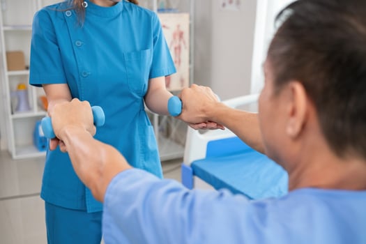 Young Caregiver Assisting Elderly Patient with Physical Therapy Exercises in a Modern Healthcare Facility photo