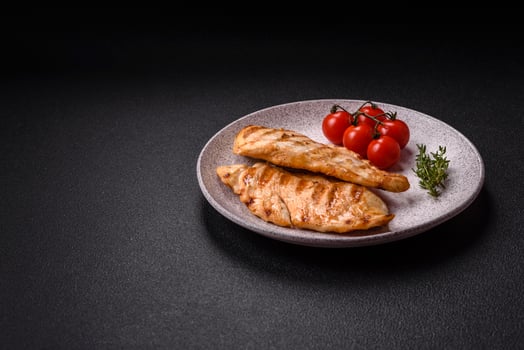 Delicious fresh grilled chicken fillet with spices and herbs photo