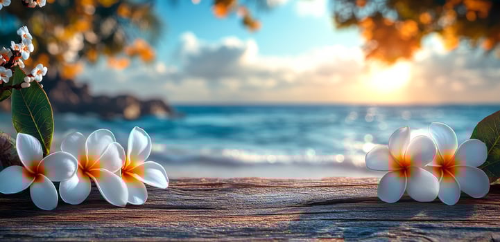 A beautiful beach scene with a wooden board and a few white flowers. The flowers are in the foreground and the board is in the background photo