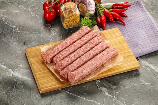 Raw beef kebab sausage for grill photo
