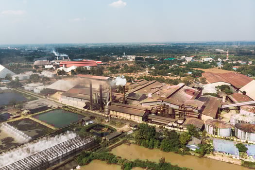 Industry factory manufacturing with emission smoke from chimneys photo