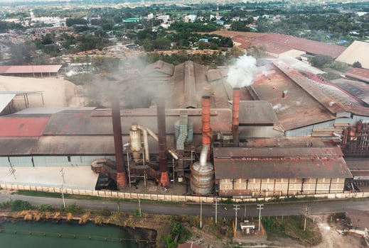 Industry factory manufacturing with emission smoke from chimneys photo
