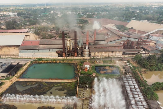 Industry factory manufacturing with pond of wastewater treatment photo