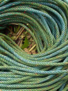 Roll bristly of green nylon rope photo