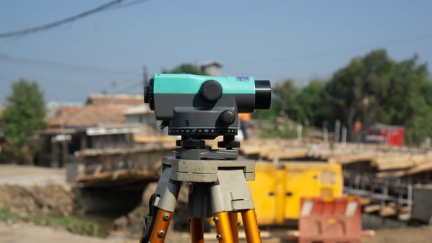 Automatic level usse for measuring level on construction site.Ensure precise measurements before undertaking construction projects. photo