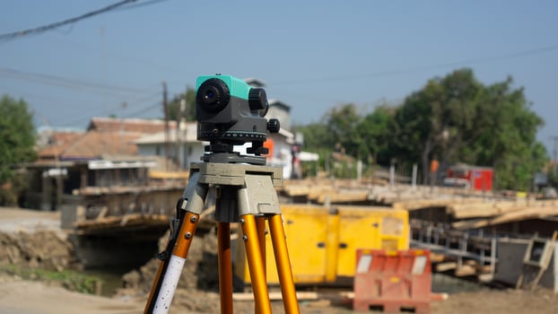 Automatic level usse for measuring level on construction site.Ensure precise measurements before undertaking construction projects. photo
