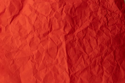 Background texture of crumpled red paper photo