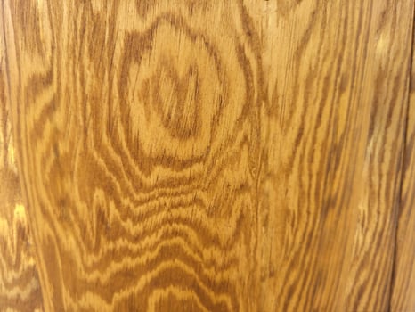Beautiful fancy yellow wood texture with brown stripes. photo