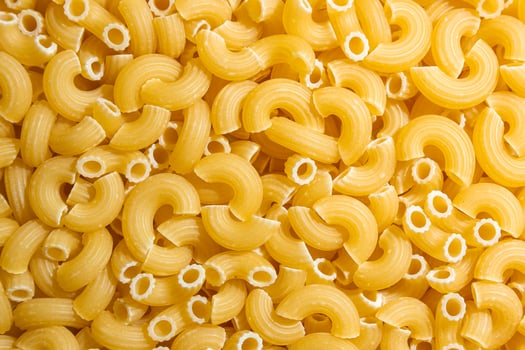 Uncooked Chifferi Rigati Pasta. A Culinary Canvas of Chifferi Rigati, Creating a Lively and Textured Background for Gourmet Cooking. Dry Pasta. Raw Macaroni - Top View, Flat Lay photo