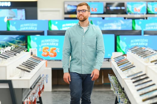 Portrait of a handsome bearded man in a home appliance store photo