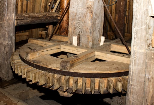Wooden flywheel of an old mill for grinding grain into flour photo