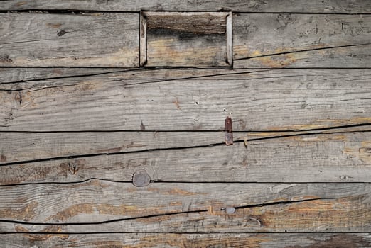 Close-up of aged, weathered wooden planks with visible grain and natural texture. photo