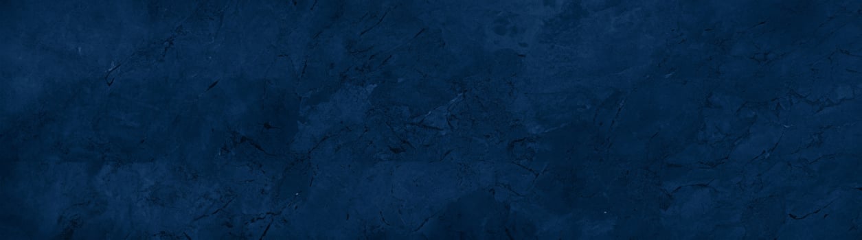 Close-up of a dark blue textured stone surface with subtle patterns and natural marbling, ideal for backgrounds. photo