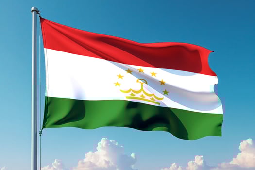 Tajikistan Flag Waving Against Clear Blue Sky photo