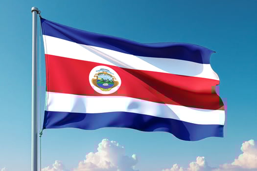 Costa Rica Flag Waving Against Clear Blue Sky photo
