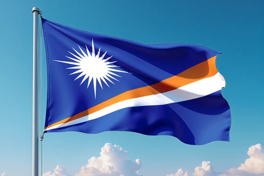 Marshall Islands Flag Waving Against Clear Blue Sky photo