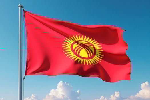 Kyrgyzstan Flag Waving Against Clear Blue Sky photo